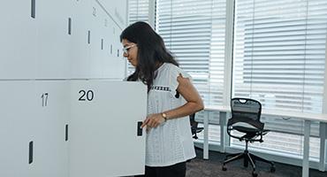 Student reaching into lockers