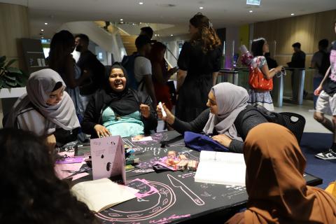 Students laughing at THE BIBLIOMANCY FEAST